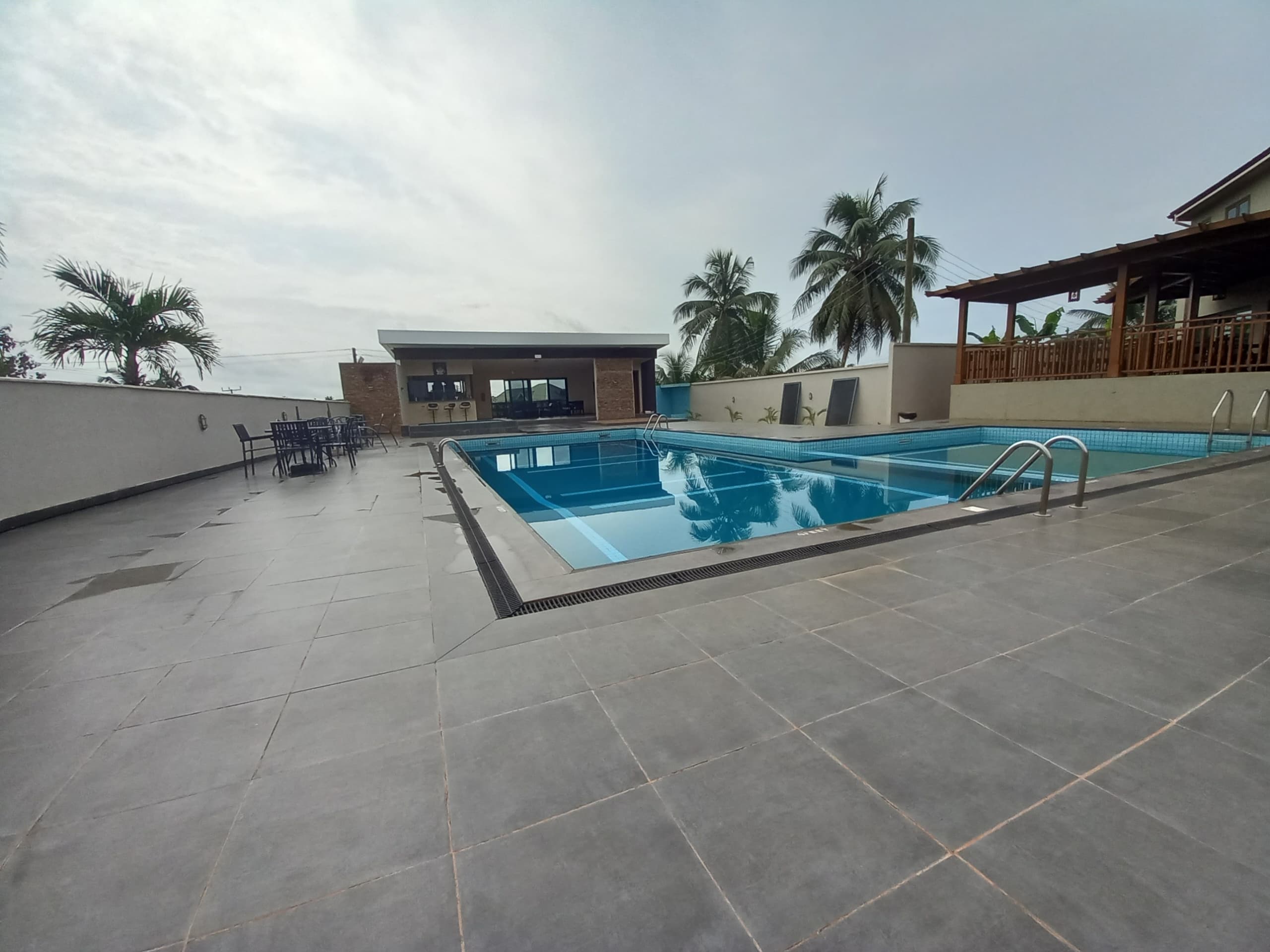 Poolside bar with clean swimming pool